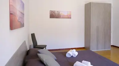 a living room with a couch and a chair at Terrasini downtown City Life in Terrasini