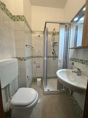 a bathroom with a toilet and a shower and a sink at Terrasini Downtown Little Square in Terrasini