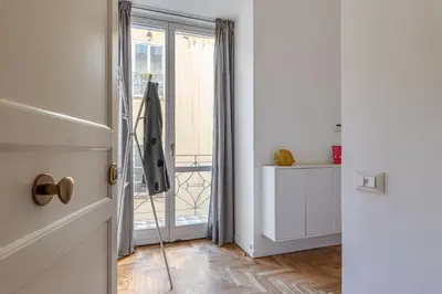 a hallway with a door open to a balcony at La Casa al Foro Vista Mare by Wonderful Italy in Palermo