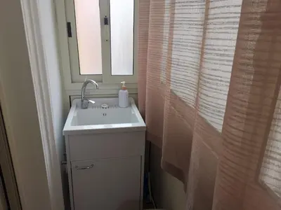 a bathroom with a sink and a mirror at Primo Piano in Palermo