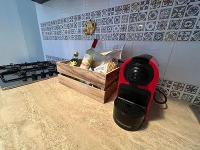 a camera sitting on the counter of a kitchen at Villa Bianca by Sicily Travelling Villas in Castellammare del Golfo
