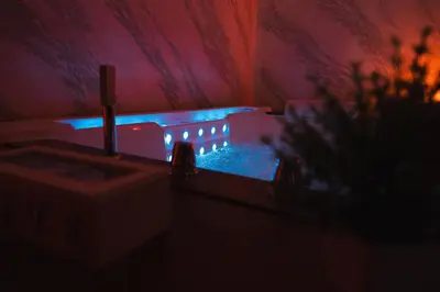 a dark room with a sink with blue lights at Papireto Rooms in Palermo