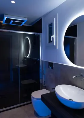 a bathroom with a white sink and a toilet at Papireto Rooms in Palermo