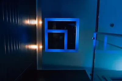 a blue room with a picture with the letter e at Papireto Rooms in Palermo