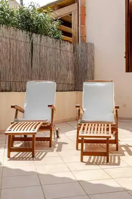 two chairs sitting next to each other on a patio at Villa Disa by Sicily Travelling Villas in Castellammare del Golfo
