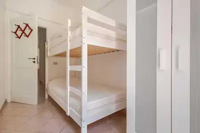 a white bunk bed in a white room at Villa Disa by Sicily Travelling Villas in Castellammare del Golfo