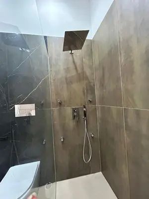 a bathroom with a shower with a shower head at Sweet dreams in Palermo