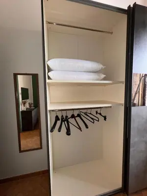 a white closet with a bunch of cooking utensils at Suli D'amuri in Palermo