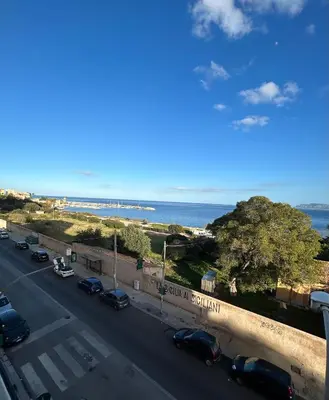 a street with cars parked on the side of a road at Casa Aura in Palermo
