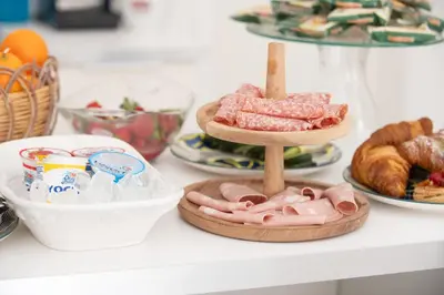 a table topped with plates of food and bread at Opera Suite in Castellammare del Golfo