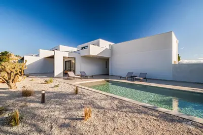 a house with a swimming pool in front of it at Villa Armonia in Partinico