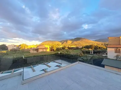 a balcony with a view of a mountain at Villa Elios Adriana con piscina a Lascari in Lascari