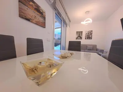 a white table with a glass bowl on top of it at Villa Elios Adriana con piscina a Lascari in Lascari