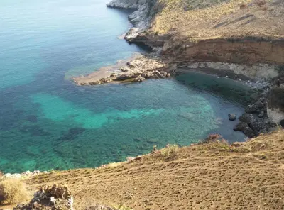 an aerial view of a cove on a rocky coast at Dimore Barraco - SiciliaDaMare in Castellammare del Golfo