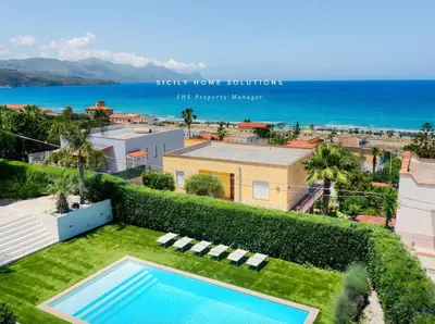 an aerial view of a swimming pool and the ocean at Oasi Elegante Piscina di Lusso - vista panoramica By Sicily Home Solutions in Alcamo
