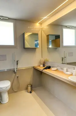 a bathroom with a toilet and a sink at Oasi Elegante Piscina di Lusso - vista panoramica By Sicily Home Solutions in Alcamo