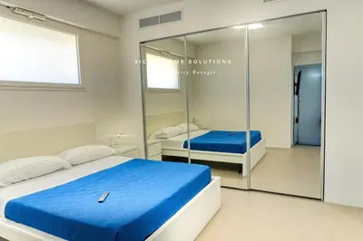 a bedroom with a bed and a mirror at Oasi Elegante Piscina di Lusso - vista panoramica By Sicily Home Solutions in Alcamo