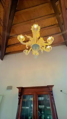 a chandelier hanging from a ceiling in a room at I Tamarindi in Palermo