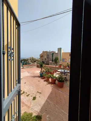 a view from a window of a patio with plants at Casa Maria Elena in Santa Flavia
