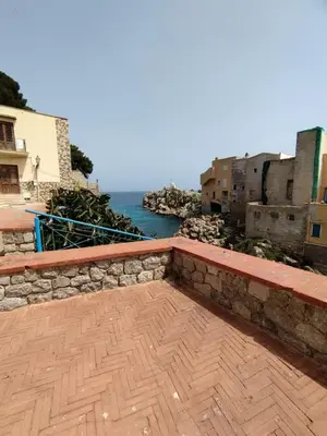 a balcony with a view of the water at Casa Maria Elena in Santa Flavia