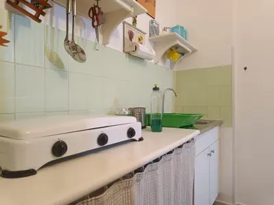 a kitchen with a stove and a sink at Trip Rooms 2 in Palermo