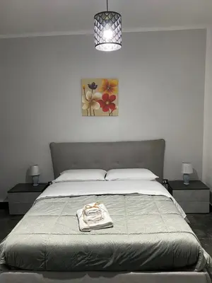 a bedroom with a bed with a towel on it at Cuor di Leone in Corleone