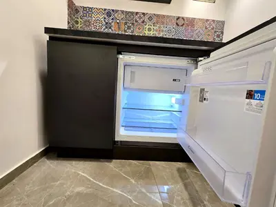an empty refrigerator with its door open in a kitchen at Vicoletto Natalia - Proppro SRL- Palermo in Palermo
