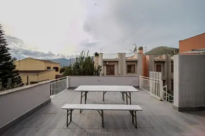 a picnic table on the roof of a building at Casa Vacanze Verdemare in Mondello