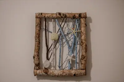 a mirror hanging on a wall with seashells at Casa Vacanze Verdemare in Mondello