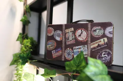 a suitcase sitting on a window sill with stickers on it at T&F Casa al Capo - In centro a Palermo in Palermo