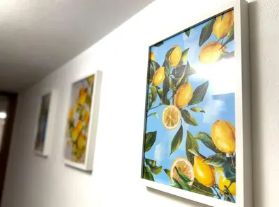 a painting of a lemon tree hanging on a wall at Nova Holidays in Palermo