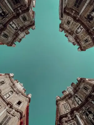 a view of the sky from the bottom of a building at Kàlia Rooms in Palermo