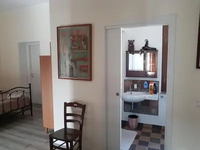 a bathroom with a sink and a mirror at Vernagallo's House 2 in Palermo