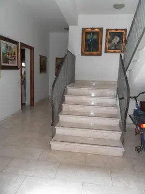 a staircase in a building with a stair case at Pompei in Castellammare del Golfo