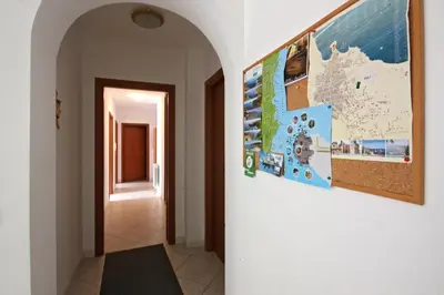 a hallway with a large map on a wall at Pompei in Castellammare del Golfo