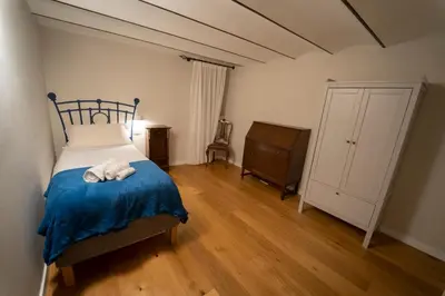 a bedroom with a bed with a blue blanket at Il Tesoretto 1 in Palermo