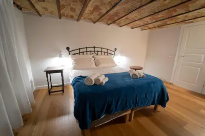 a bedroom with a bed with two towels on it at Il Tesoretto 1 in Palermo