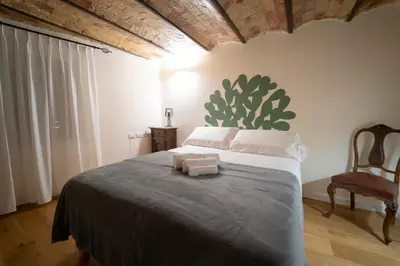 a bedroom with a bed with two towels on it at Il Tesoretto 2 in Palermo