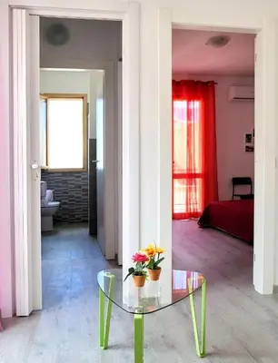 a bathroom with a white sink and a toilet at SoleMar in Castellammare del Golfo
