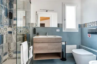 a bathroom with a sink and a toilet at Le Piccole Duse in Palermo