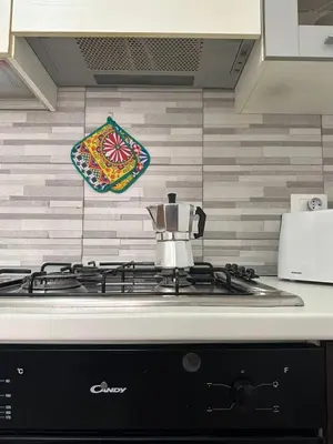 a tea pot sitting on top of a stove at Soraya House Next quattrocanti in Palermo