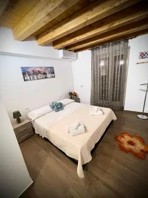 a bedroom with a large bed in a room at Il carrettiere in Termini Imerese