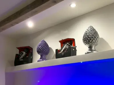 three vases sitting on a shelf in a room at My Life in Palermo
