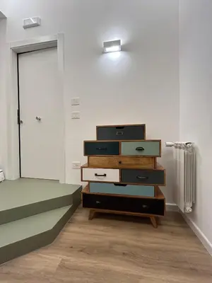 a room with a stack of dressers with a door at Pirandello 181 in Palermo