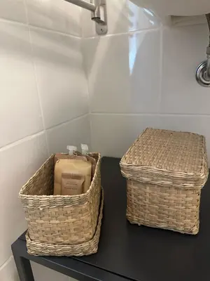 two baskets sitting on top of a black table at Pirandello 181 in Palermo