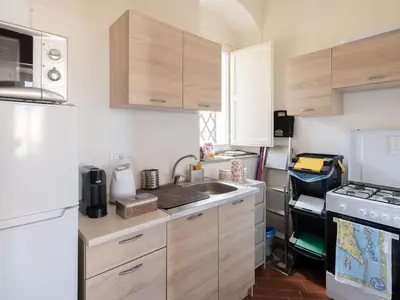 a bathroom with two sinks and a toilet at Apartment in Villa Storica Lanterna sul Mare Palermo in Palermo