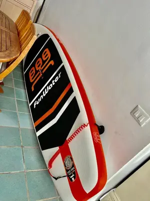 a surfboard sitting on top of a refrigerator at Villa Donna Toni in Carini