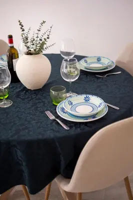 a black table with plates and wine glasses on it at With love, Apartment 4 in Palermo