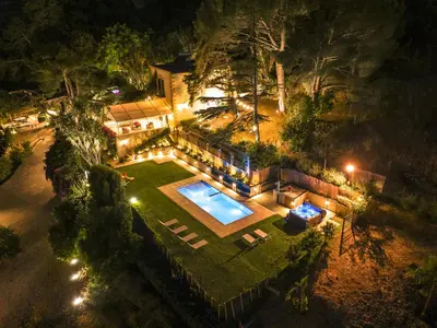 an aerial view of a house at night with a swimming pool at Villa Tommaso Maruggi, Sicilia, con Jacuzzi e piscina privata in Alcamo