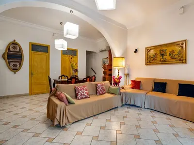 a living room with two couches in a room at Villa Tommaso Maruggi, Sicilia, con Jacuzzi e piscina privata in Alcamo
